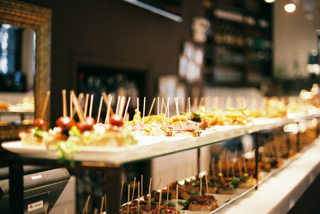 Catering buffet line with a variety of appetisers on display