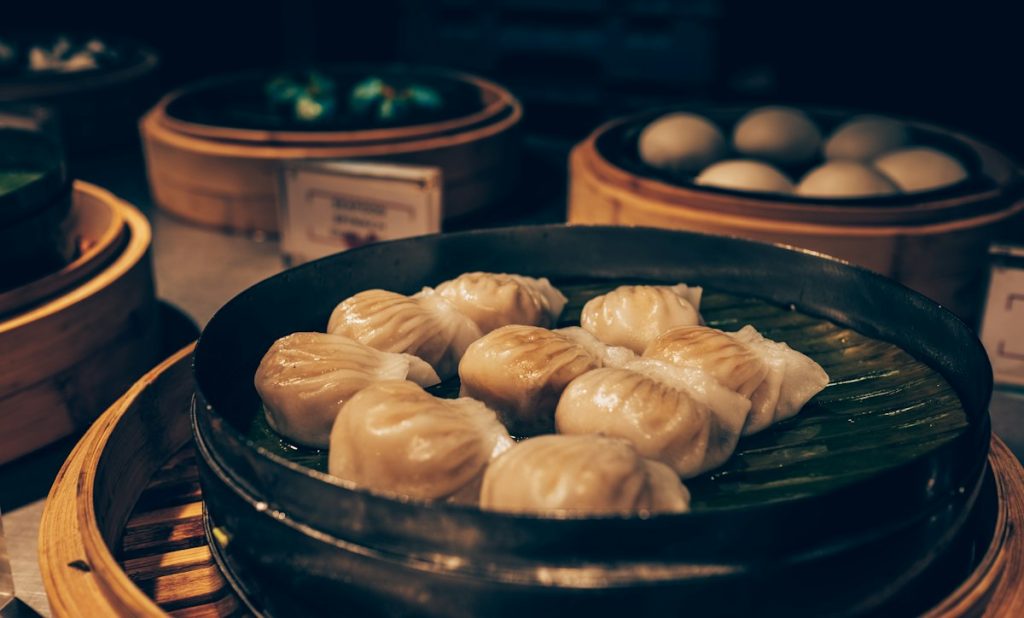 Steamed dumplings in a black pan